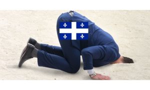 Photo of a businessman with their head in the sand. The businessman is wearing a Quebec flag. Nathalie Bergeron said Quebec's disinterest in an open online gambling market is "disconnected from the current reality."