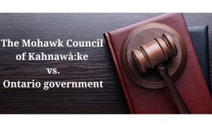 Gavel on a desk beside the words: The Mohawk Council of Kahnawà:ke vs. the Ontario government. The court challenge is to determine the legality of the Ontario online gambling sector.