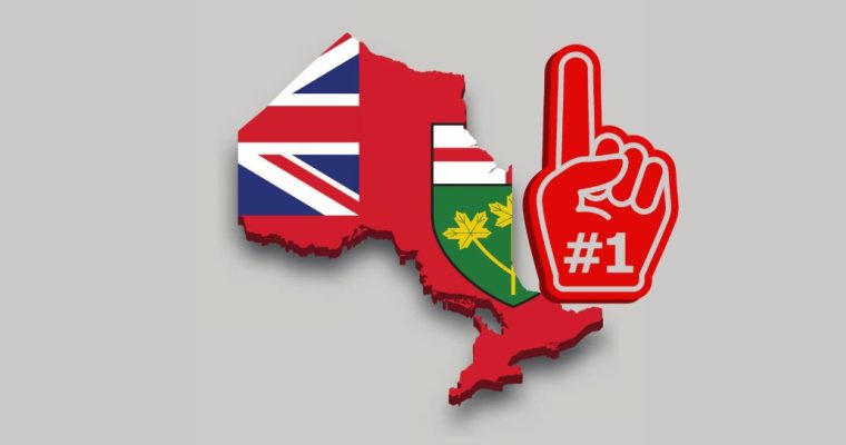 3D outline of Ontario with the Ontario flag on it beside a large red foam finger saying #1. Ontario's online gambling revenue grew 71% to $2.4 billion in year two. Even in US dollars, that's better than year two for PA, MI and NJ.