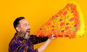 Man eating a very large slice of pizza. According to recent estimates by Eilers & Krejcik Gaming, BetMGM has a 20% share of the combined Ontario online gambling market.