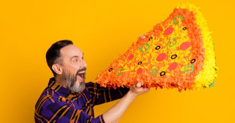 Man eating a very large slice of pizza. According to recent estimates by Eilers & Krejcik Gaming, BetMGM has a 20% share of the combined Ontario online gambling market.