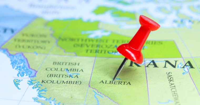 Red pushpin on Alberta map highlighting BetMGM's market expansion into Canadian province